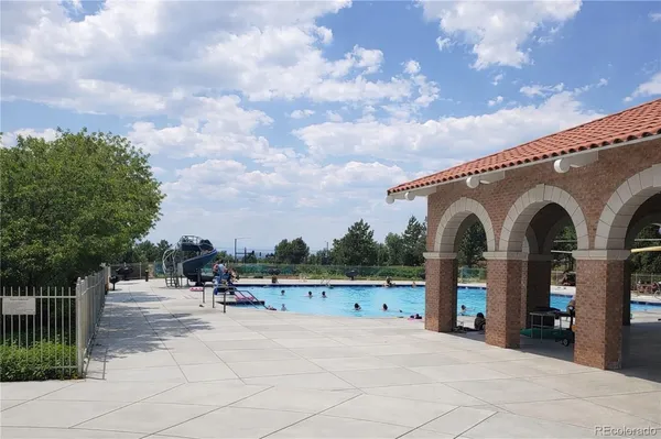 a view of swimming pool with a patio