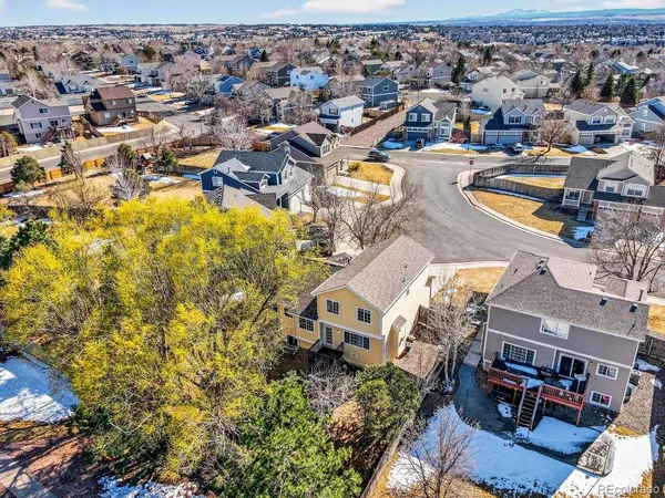 an aerial view of a house with a garden