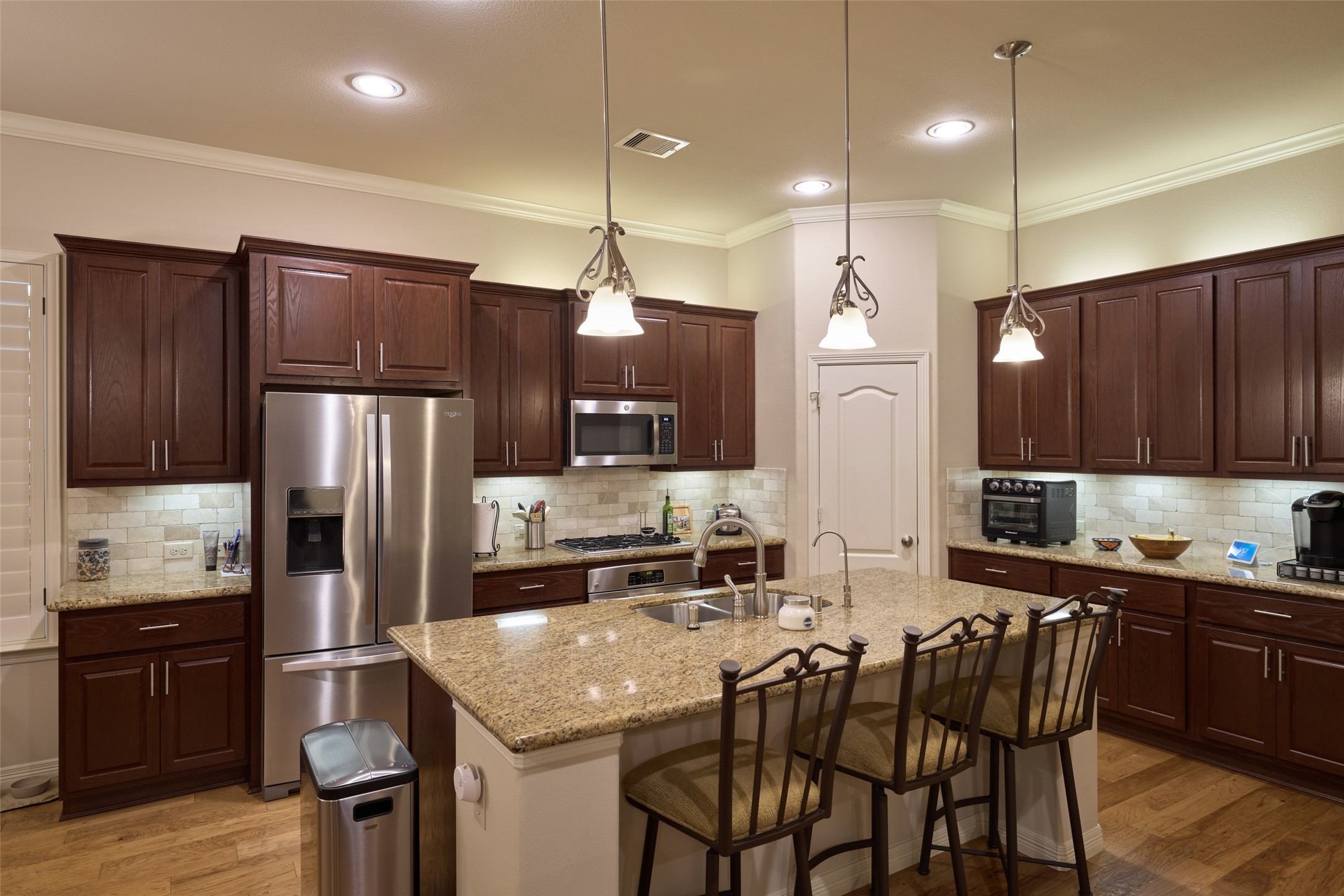 2706 Berners-Lee Avenue Spring, TX 77381 - Photo 8 of 43 The cabinets have upper and lower lighting. All of the lowers have pull out shelving for efficient use of space. The walk-in pantry has a custom spice rack and automatic lighting.