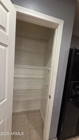 a bathroom with a toilet and a mirror