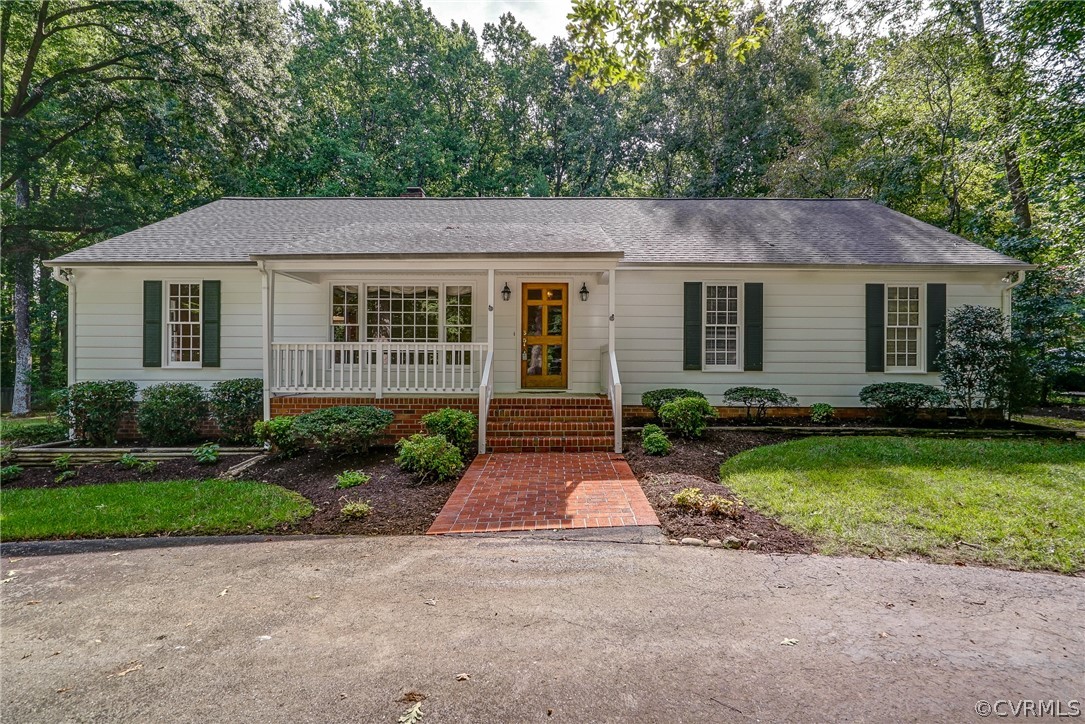 3909 Cheyenne Road Richmond, VA 23235 - Photo 1 of 47 a front view of a house with garden