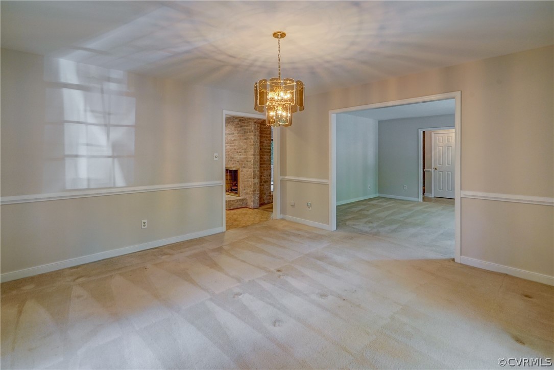 3909 Cheyenne Road Richmond, VA 23235 - Photo 18 of 47 an empty room with chandelier fan