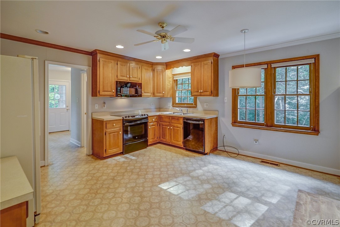 3909 Cheyenne Road Richmond, VA 23235 - Photo 19 of 47 a kitchen with stainless steel appliances granite countertop a stove top oven a sink and a refrigerator