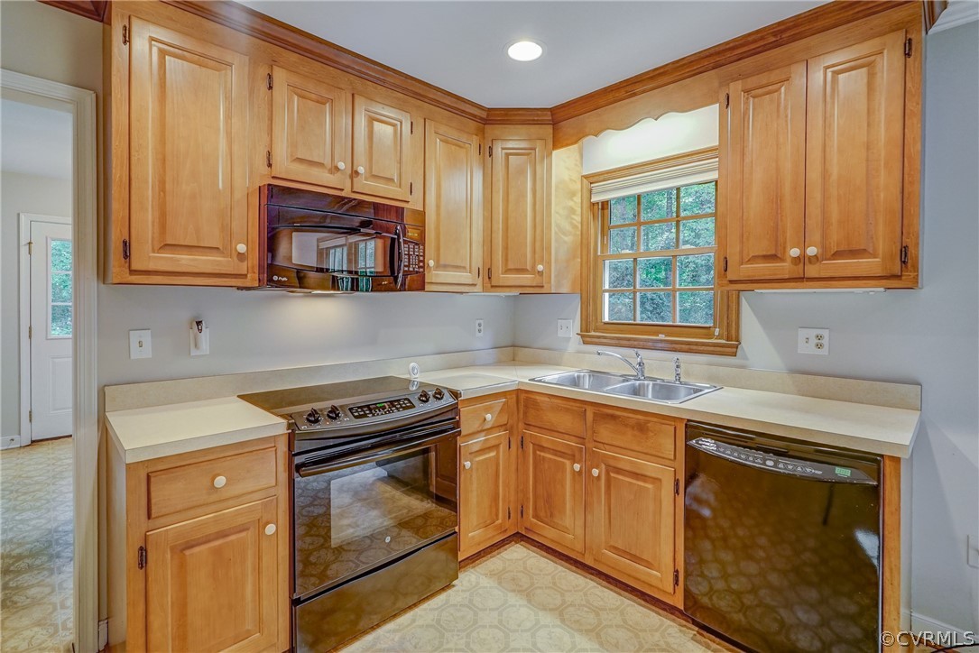 3909 Cheyenne Road Richmond, VA 23235 - Photo 21 of 47 a kitchen with cabinets appliances a sink and a window