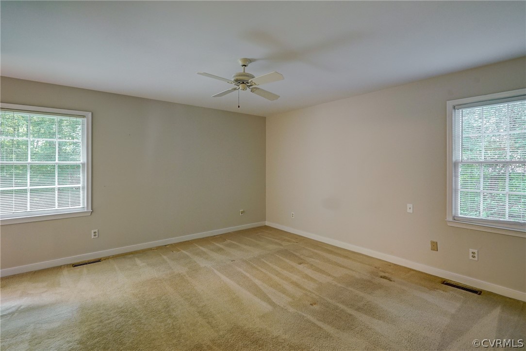 3909 Cheyenne Road Richmond, VA 23235 - Photo 34 of 47 an empty room with a window and ceiling fan