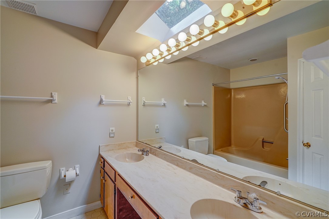 3909 Cheyenne Road Richmond, VA 23235 - Photo 37 of 47 a bathroom with a sink a light fixture and a toilet