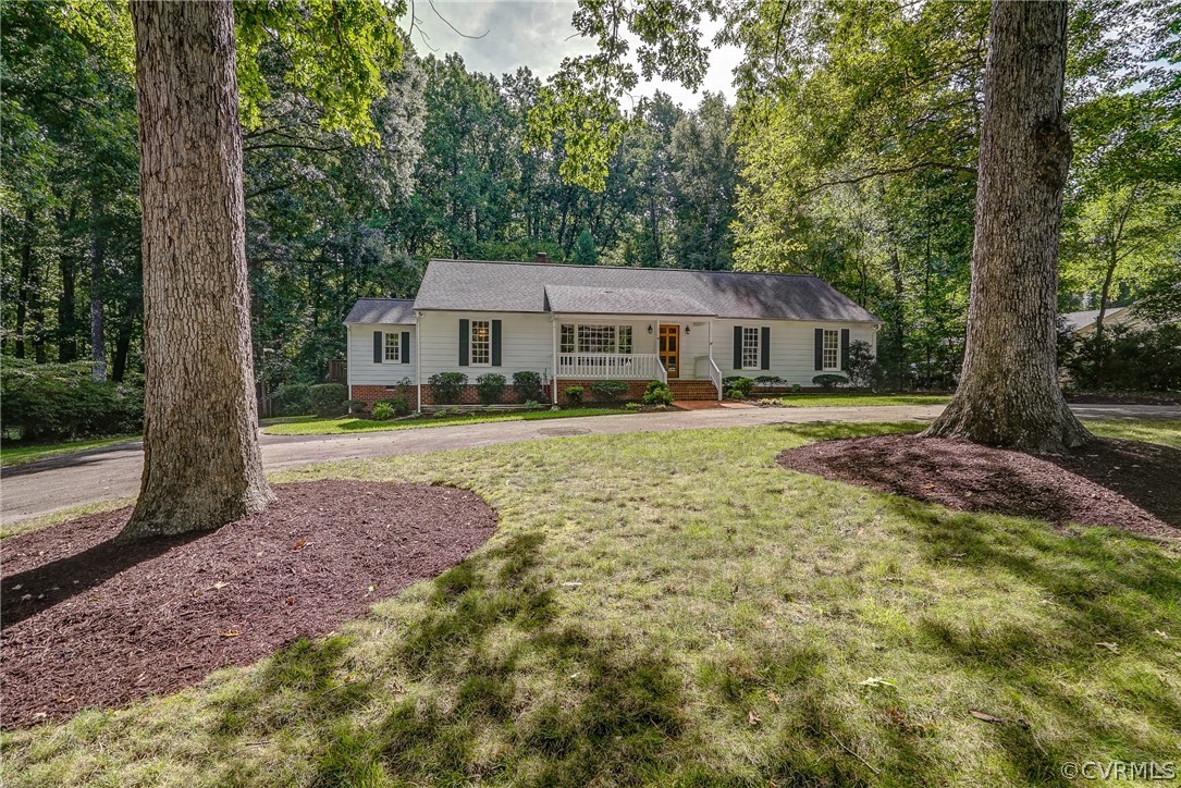 3909 Cheyenne Road Richmond, VA 23235 - Photo 6 of 47 a front view of a house with a yard