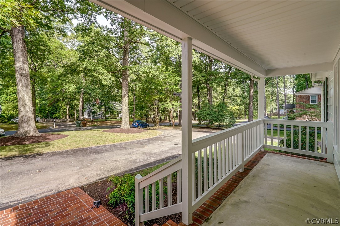 3909 Cheyenne Road Richmond, VA 23235 - Photo 9 of 47 a view of a porch with wooden floor and fence