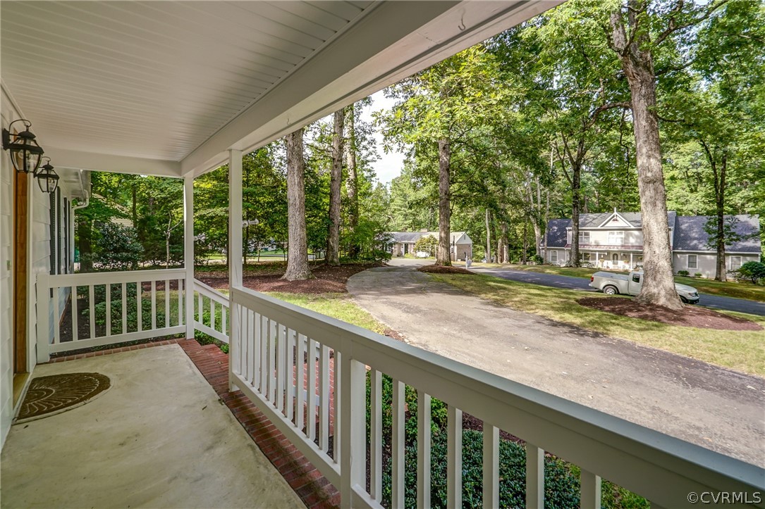 3909 Cheyenne Road Richmond, VA 23235 - Photo 10 of 47 a view of a porch with wooden floor and fence