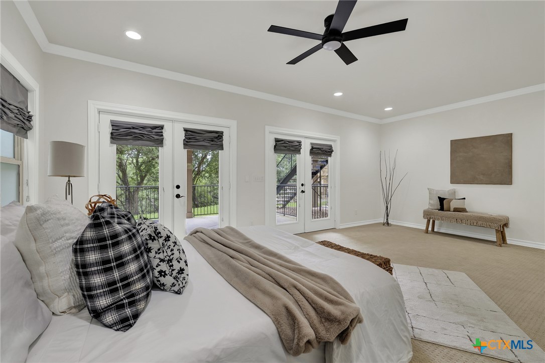 1029 Gruene Road New Braunfels, TX 78130 - Photo 20 of 48 a bedroom with a bed a couch and a window