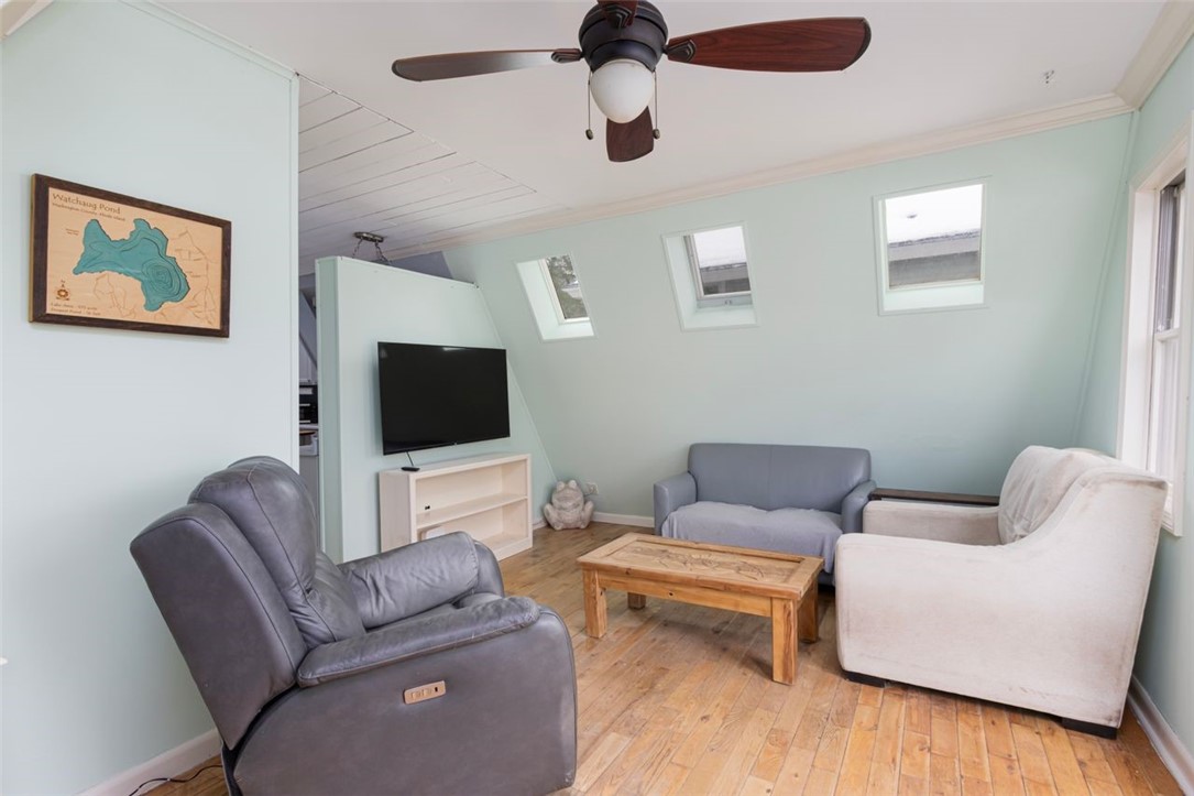 27 Ricks Road Charlestown, RI 02813 - Photo 13 of 38 Living room- french door to the front deck is on the right