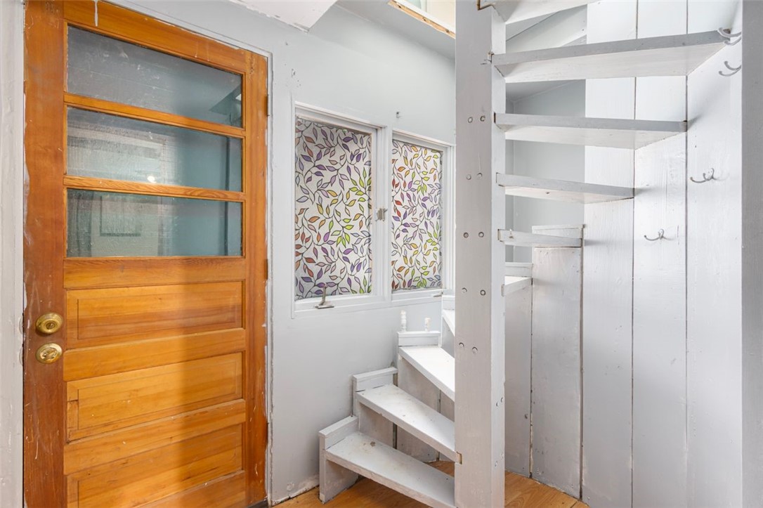 27 Ricks Road Charlestown, RI 02813 - Photo 24 of 38 Spiral staircase in the lower level with a walk out to the driveway
