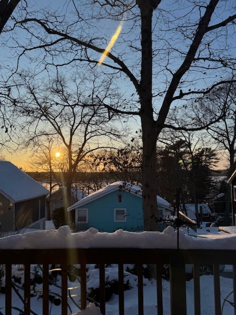 27 Ricks Road Charlestown, RI 02813 - Photo 33 of 38 Winter sunset view over Watchaug Pond from the front deck