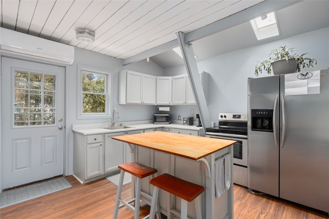 27 Ricks Road Charlestown, RI 02813 - Photo 4 of 38 Kitchen with rustic charm-stove and refrigerator
to remain