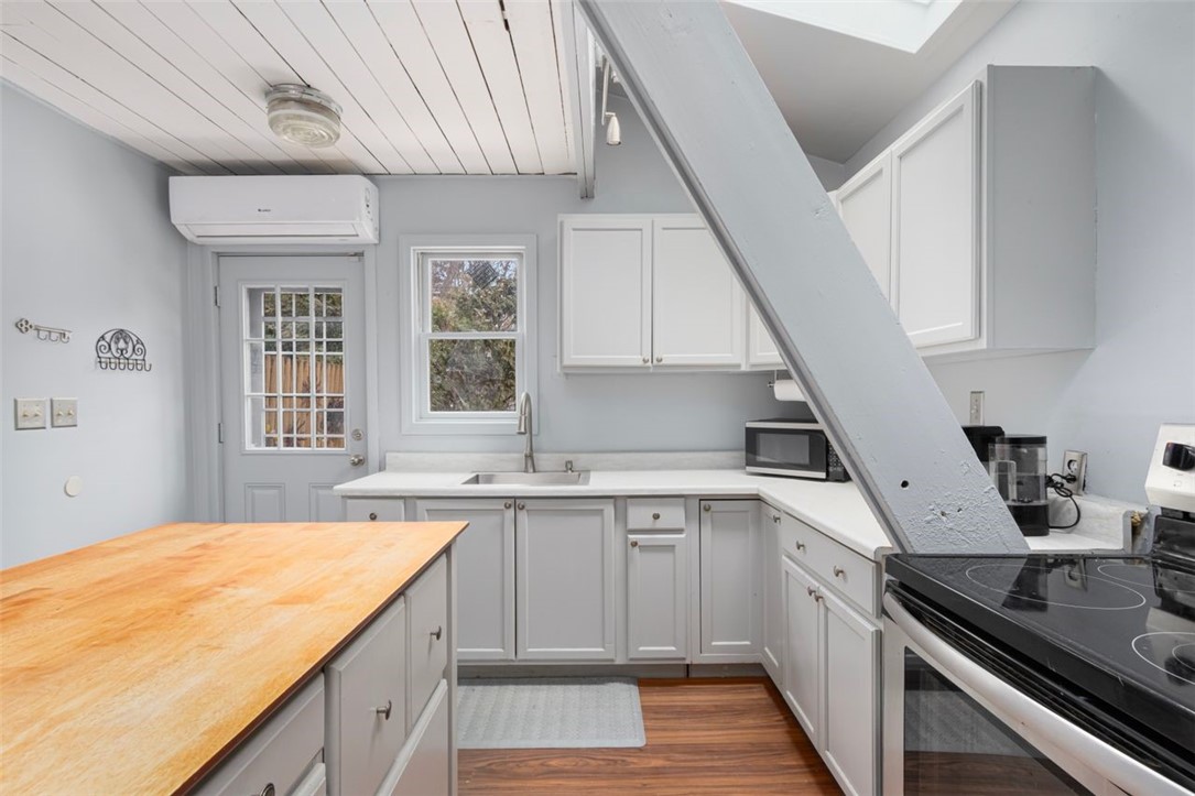 27 Ricks Road Charlestown, RI 02813 - Photo 6 of 38 Kitchen with distinctive A frame construction. Door to the private
back deck