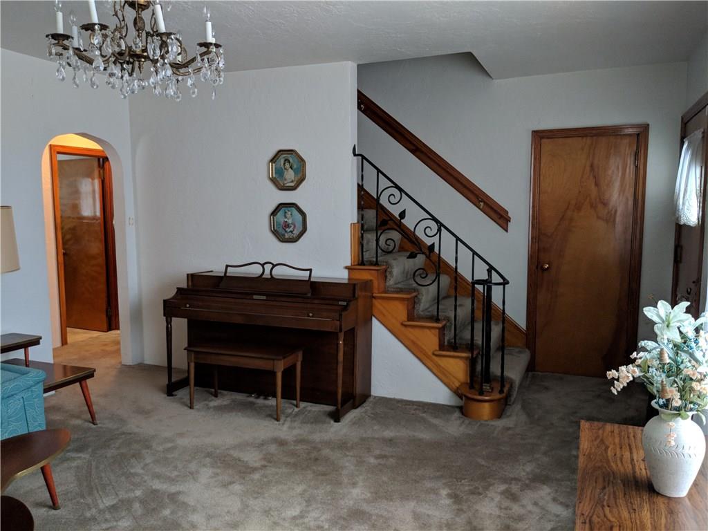 205 Montgomery Road Scottdale, PA 15683 - Photo 15 of 25 living room view of front entry and guest closet