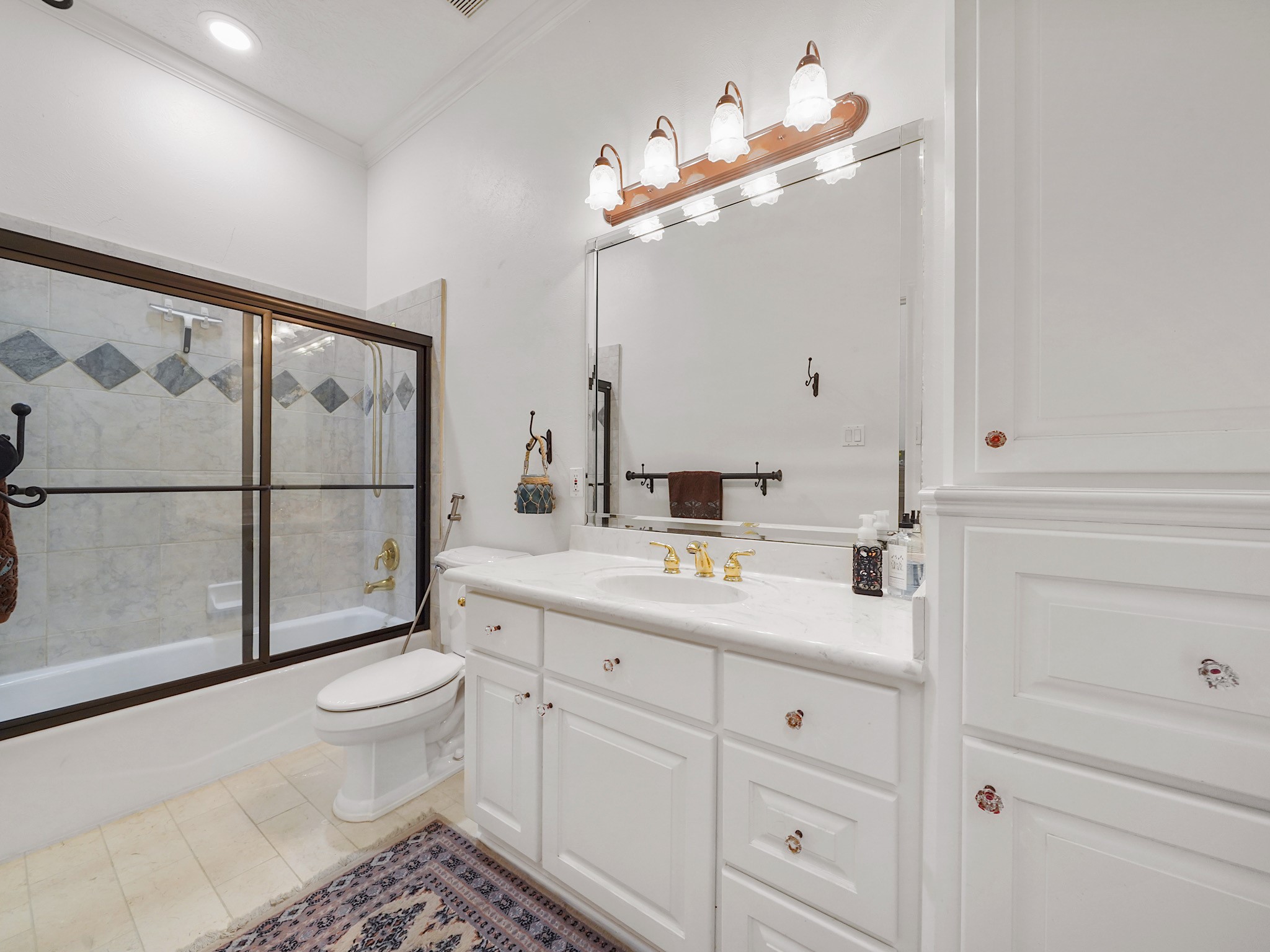 32134 Fulbrook Commons Fulshear, TX 77441 - Photo 26 of 49 A well-appointed secondary bath features clean lines, generous counter space, and refined finishes that maintain the home’s elevated aesthetic.