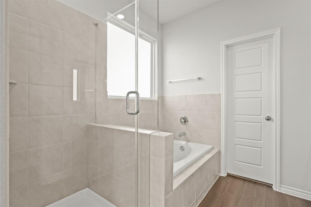 5025 Wellborn Road Crowley, TX 76036 - Photo 11 of 38 a bathroom with a bathtub and shower
