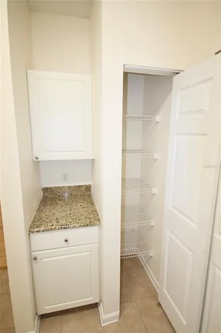 a kitchen with stainless steel appliances a refrigerator and a stove top oven