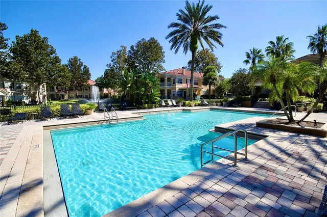 a view of a house with garden and trees