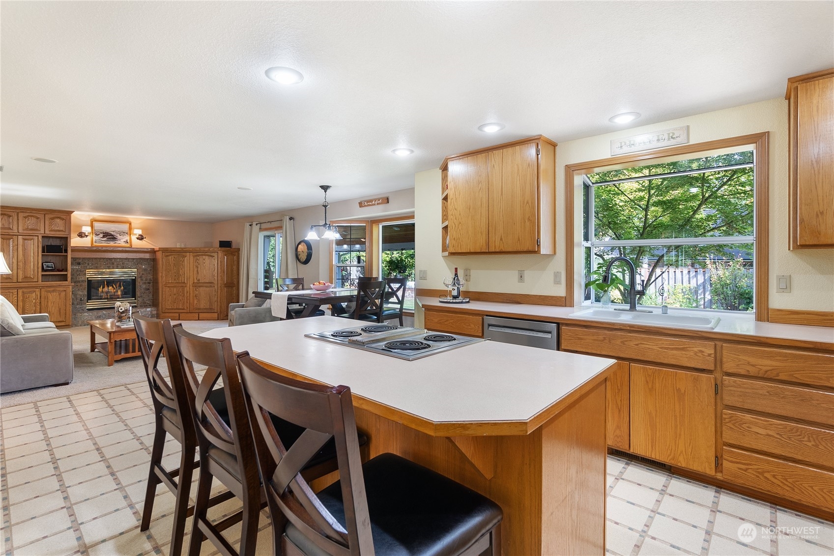 2540 Walnut Loop Northwest Olympia, WA 98502 - Photo 13 of 30 a kitchen with a table chairs and a refrigerator