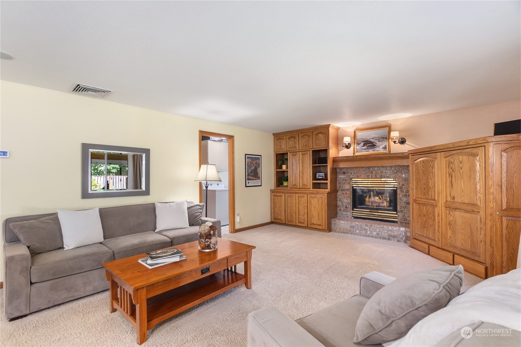 2540 Walnut Loop Northwest Olympia, WA 98502 - Photo 17 of 30 a living room with furniture and a fireplace