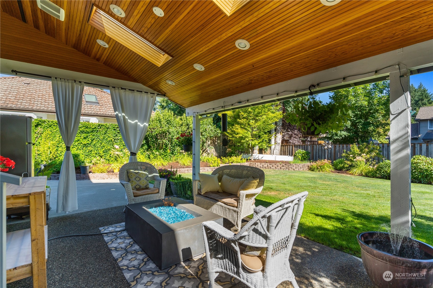 2540 Walnut Loop Northwest Olympia, WA 98502 - Photo 4 of 30 a view of a patio with a table chairs and a backyard