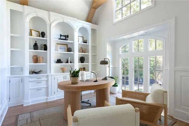 a kitchen with kitchen island stainless steel appliances a sink and cabinets