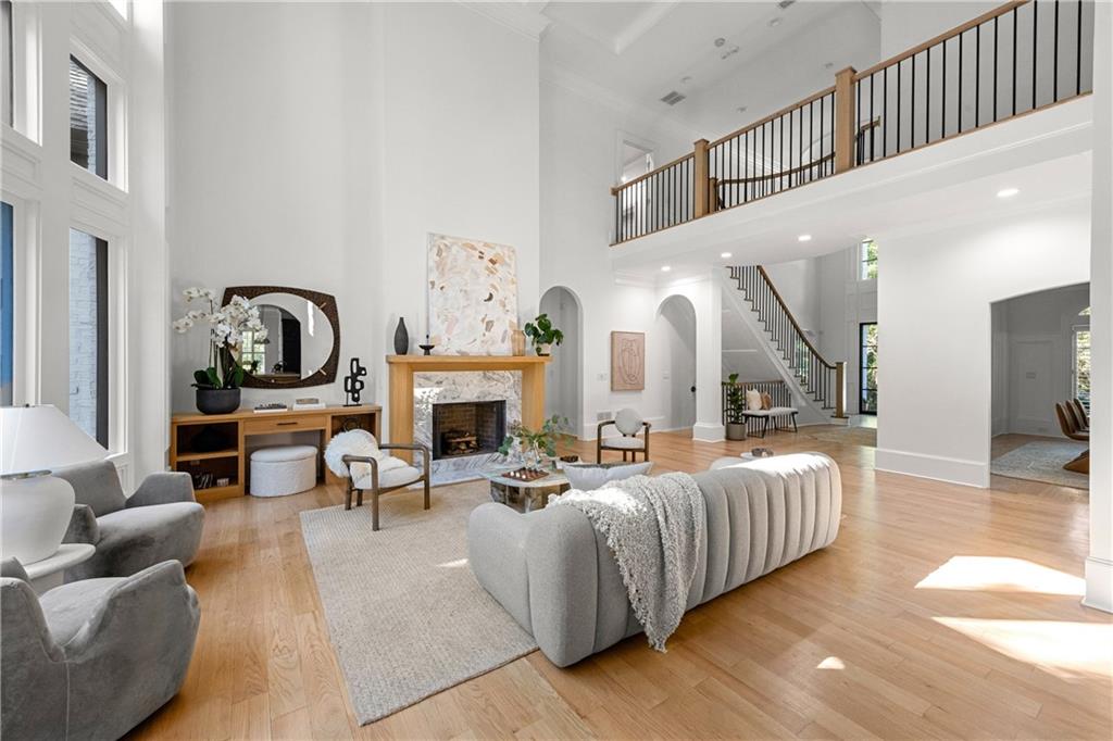 2079 Old Settlement Road Northwest Atlanta, GA 30327 - Photo 17 of 78 a living room with fireplace furniture and a wooden floor