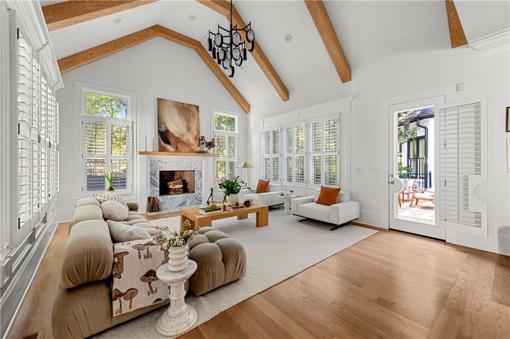 2079 Old Settlement Road Northwest Atlanta, GA 30327 - Photo 23 of 78 a living room with furniture and a fireplace
