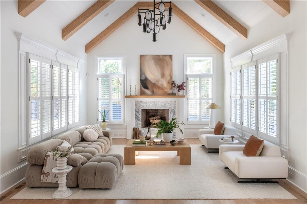 2079 Old Settlement Road Northwest Atlanta, GA 30327 - Photo 24 of 78 a living room with furniture and a fireplace