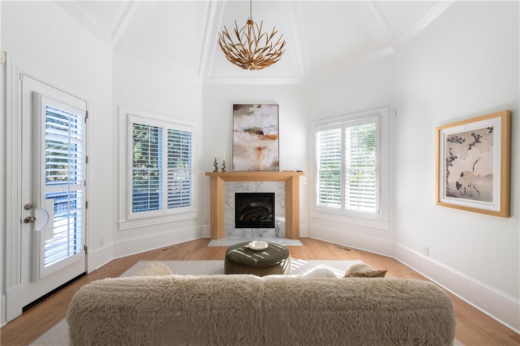 2079 Old Settlement Road Northwest Atlanta, GA 30327 - Photo 30 of 78 a bedroom with a bed and a fireplace