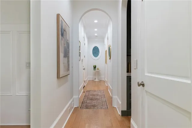 a dining hall with stainless steel appliances granite countertop a sink and a large window