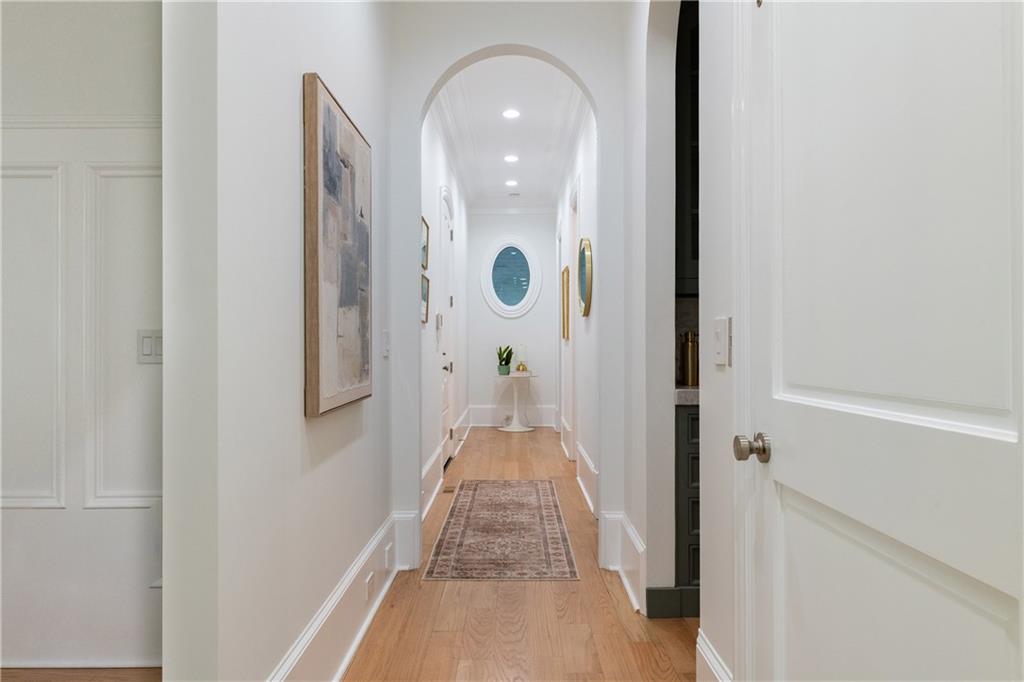 2079 Old Settlement Road Northwest Atlanta, GA 30327 - Photo 36 of 78 a view of a hallway with wooden floor and staircase