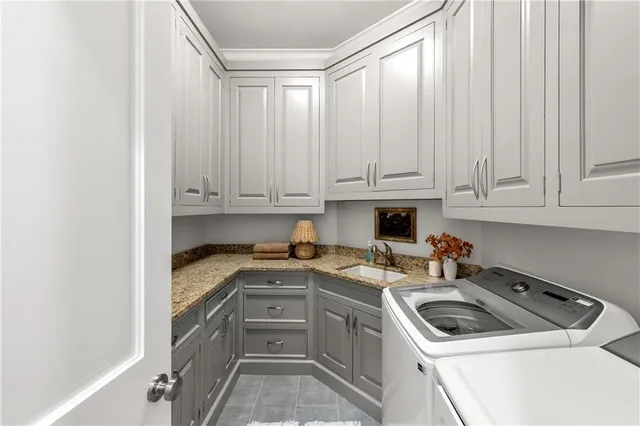 a view of a swimming pool with lawn chairs under an umbrella