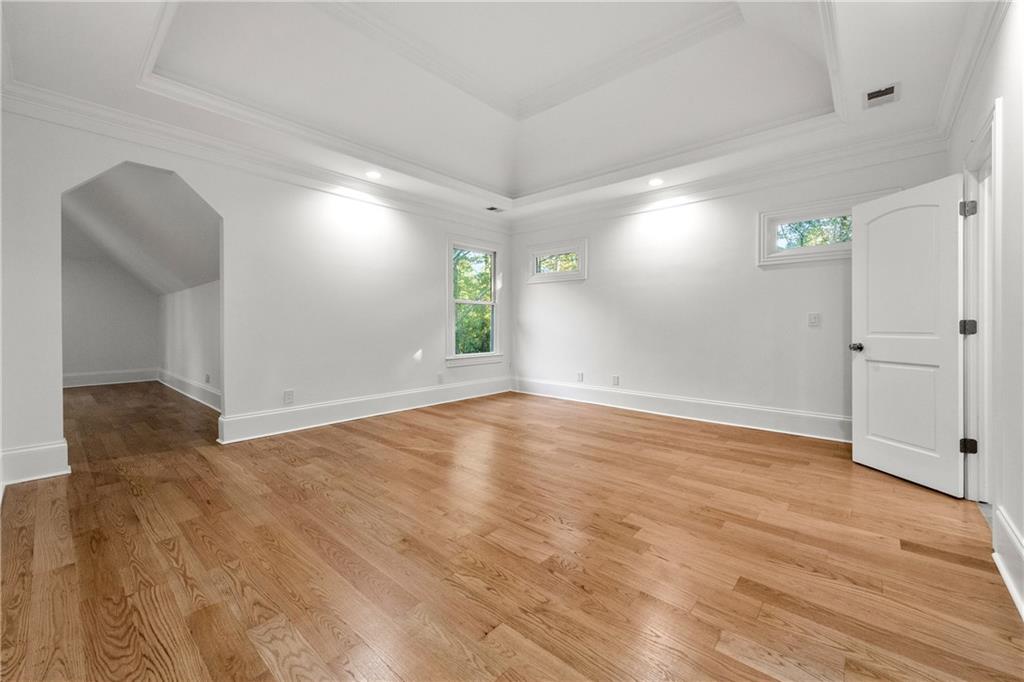 2079 Old Settlement Road Northwest Atlanta, GA 30327 - Photo 41 of 78 wooden floor in an empty room with a window