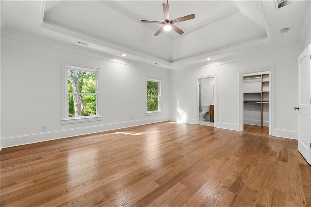 2079 Old Settlement Road Northwest Atlanta, GA 30327 - Photo 45 of 78 a view of an empty room with window and wooden floor