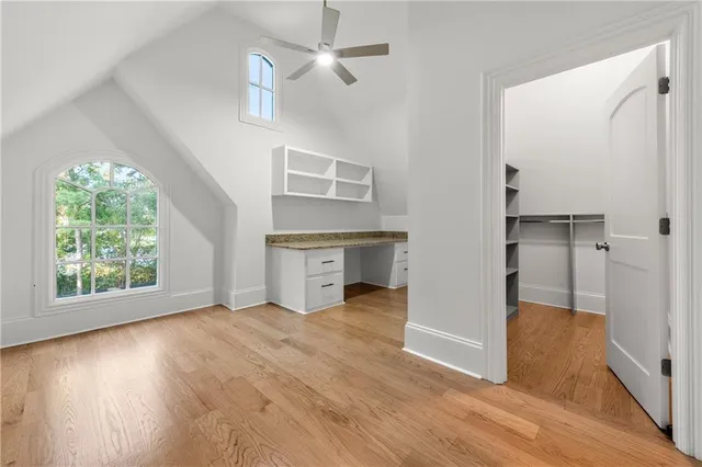 an aerial view of house with yard and mountain view in back