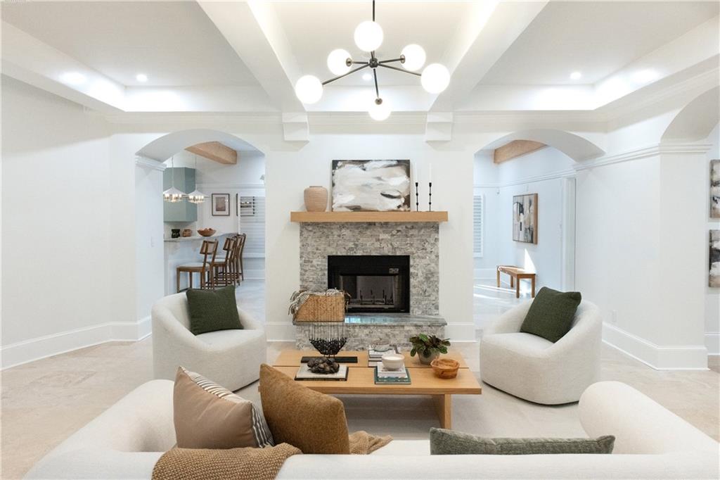 2079 Old Settlement Road Northwest Atlanta, GA 30327 - Photo 54 of 78 a living room with furniture and a fireplace