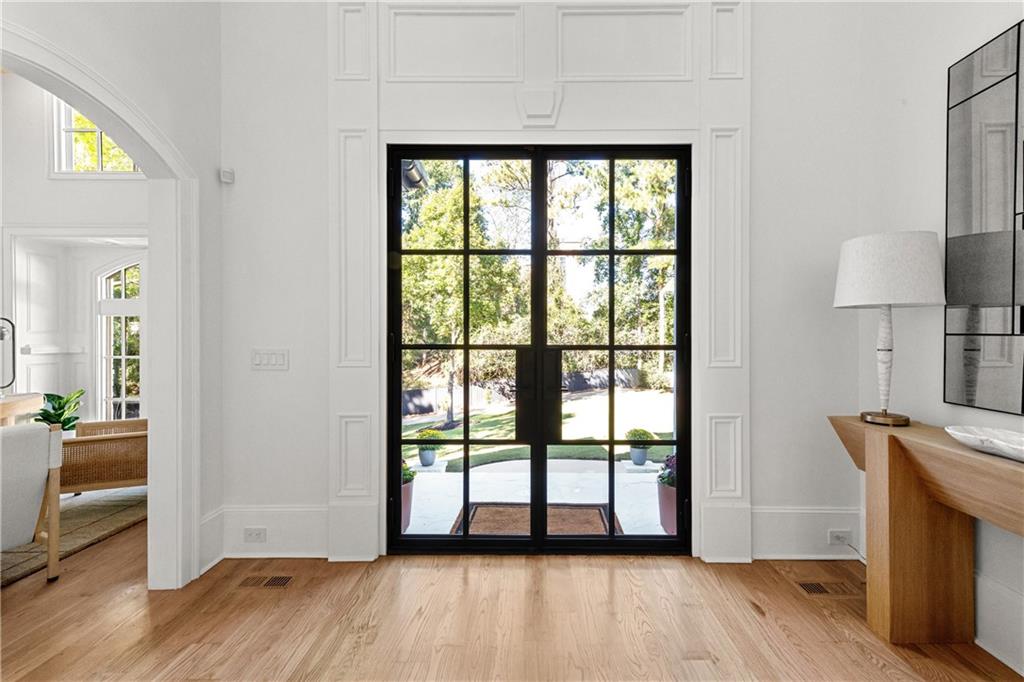 2079 Old Settlement Road Northwest Atlanta, GA 30327 - Photo 10 of 78 a view of empty room with wooden floor and fan