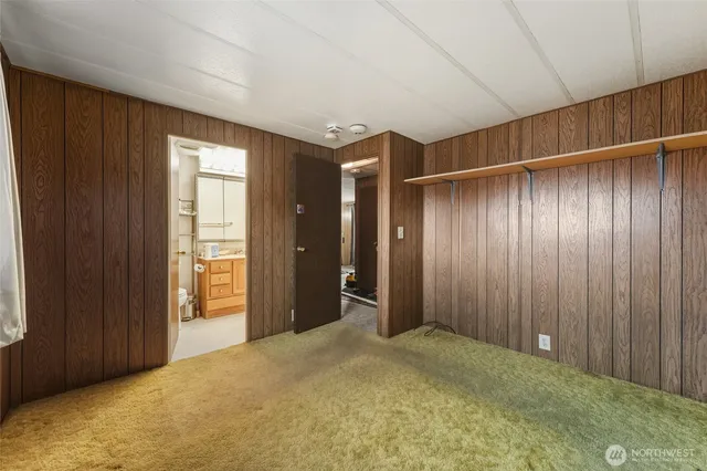 a view of an empty room with wooden walls