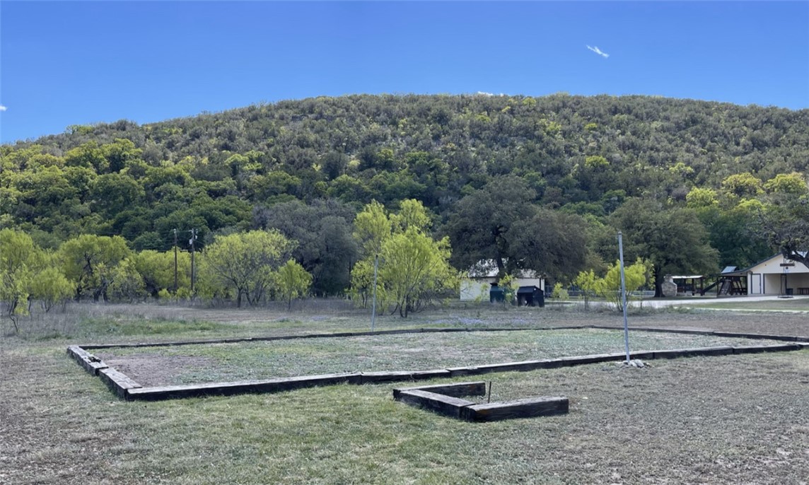 197 Tomahawk Way Concan, TX 78838 - Photo 14 of 18 a view of a yard with mountain