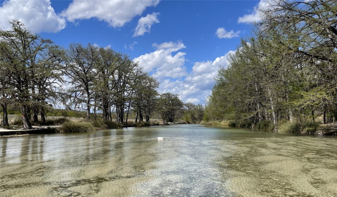 197 Tomahawk Way Concan, TX 78838 - Photo 15 of 18 a view of a yard with a house