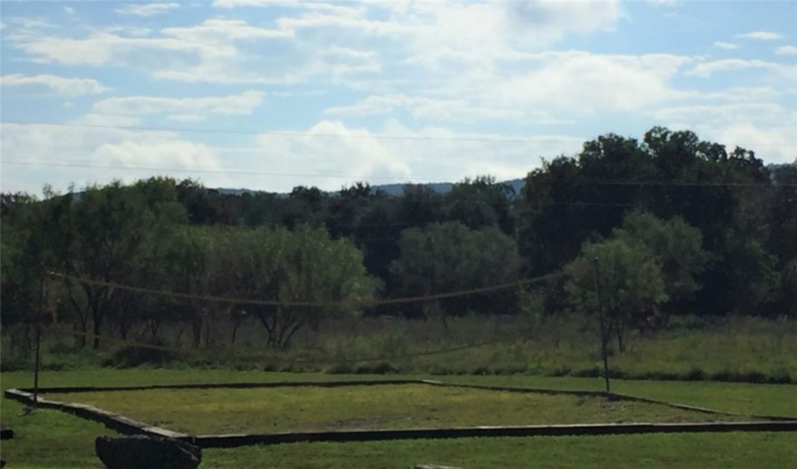 197 Tomahawk Way Concan, TX 78838 - Photo 16 of 18 a view of a yard