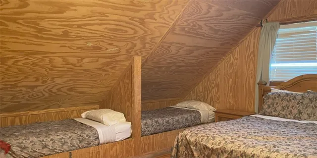 a bedroom with a bed and a shower