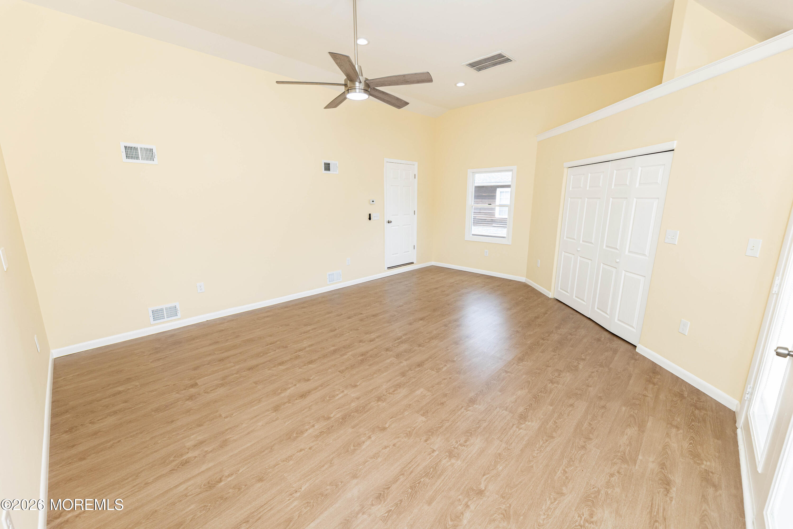 2408 Herbertsville Road Point Pleasant, NJ 08742 - Photo 33 of 82 an empty room with a ceiling fan and a window