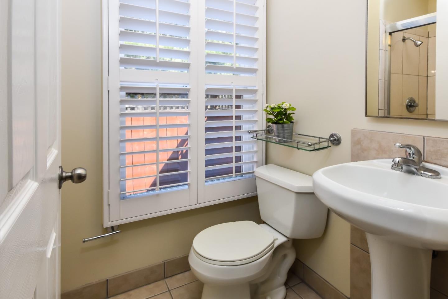 1100 Rosedale Avenue Burlingame, CA 94010 - Photo 15 of 15 a bathroom with a granite countertop toilet a sink and a mirror