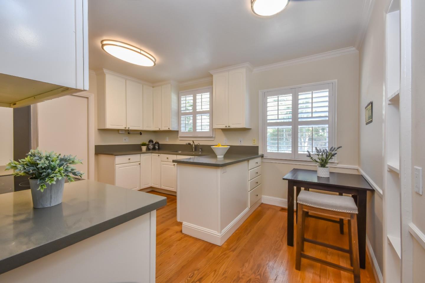 1100 Rosedale Avenue Burlingame, CA 94010 - Photo 8 of 15 a kitchen with a sink appliances cabinets and a potted plant
