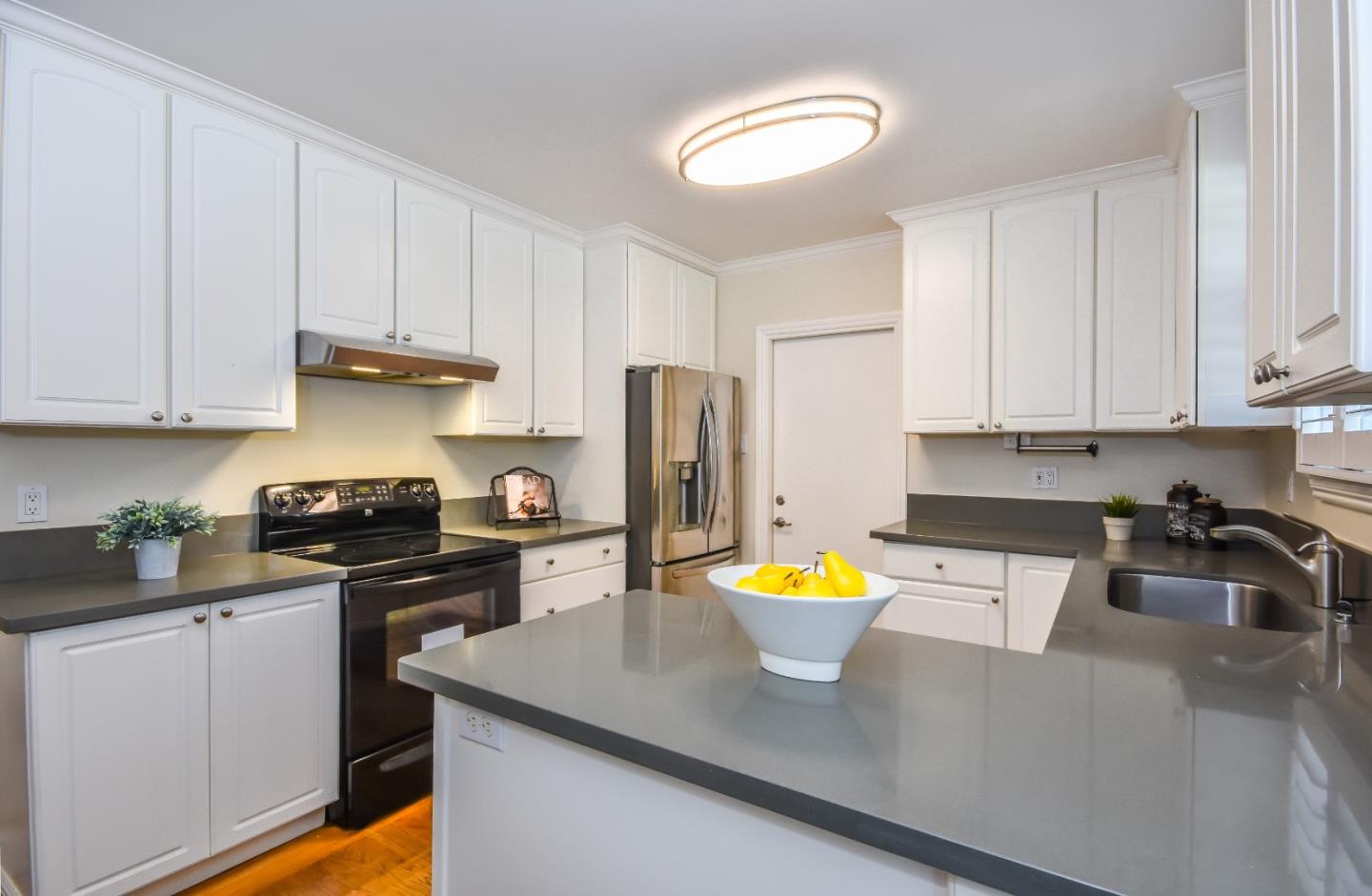 1100 Rosedale Avenue Burlingame, CA 94010 - Photo 9 of 15 a kitchen with stainless steel appliances granite countertop a sink a stove and a refrigerator