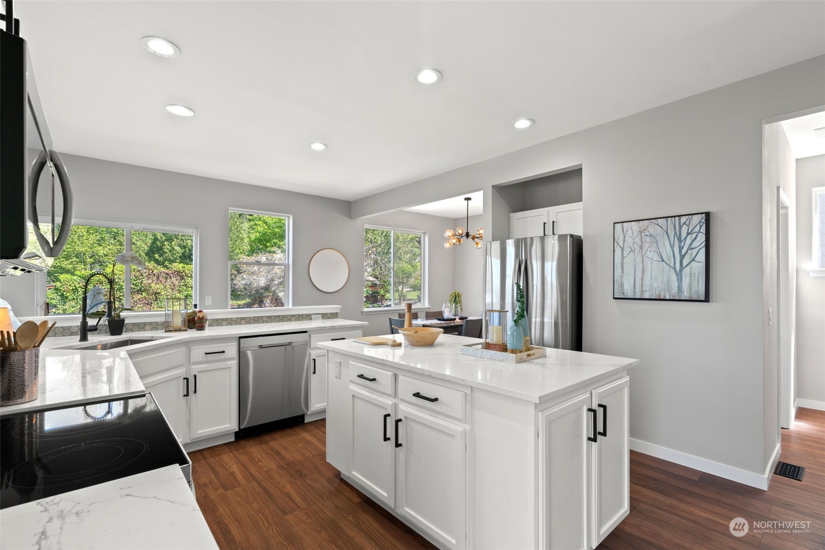 1208 South 35th Street Renton, WA 98055 - Photo 13 of 26 a kitchen with a sink stove and cabinets